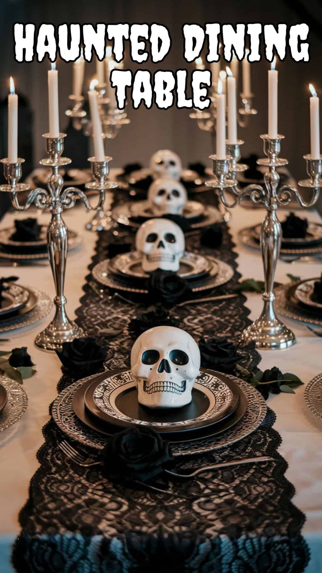 A photo of an elegant Halloween dining table. There is a black lace runner down the center, with skull plates placed on top. There are black roses interspersed among the plates. At each end of the table, there is a flickering candelabra. The background is dimly lit.