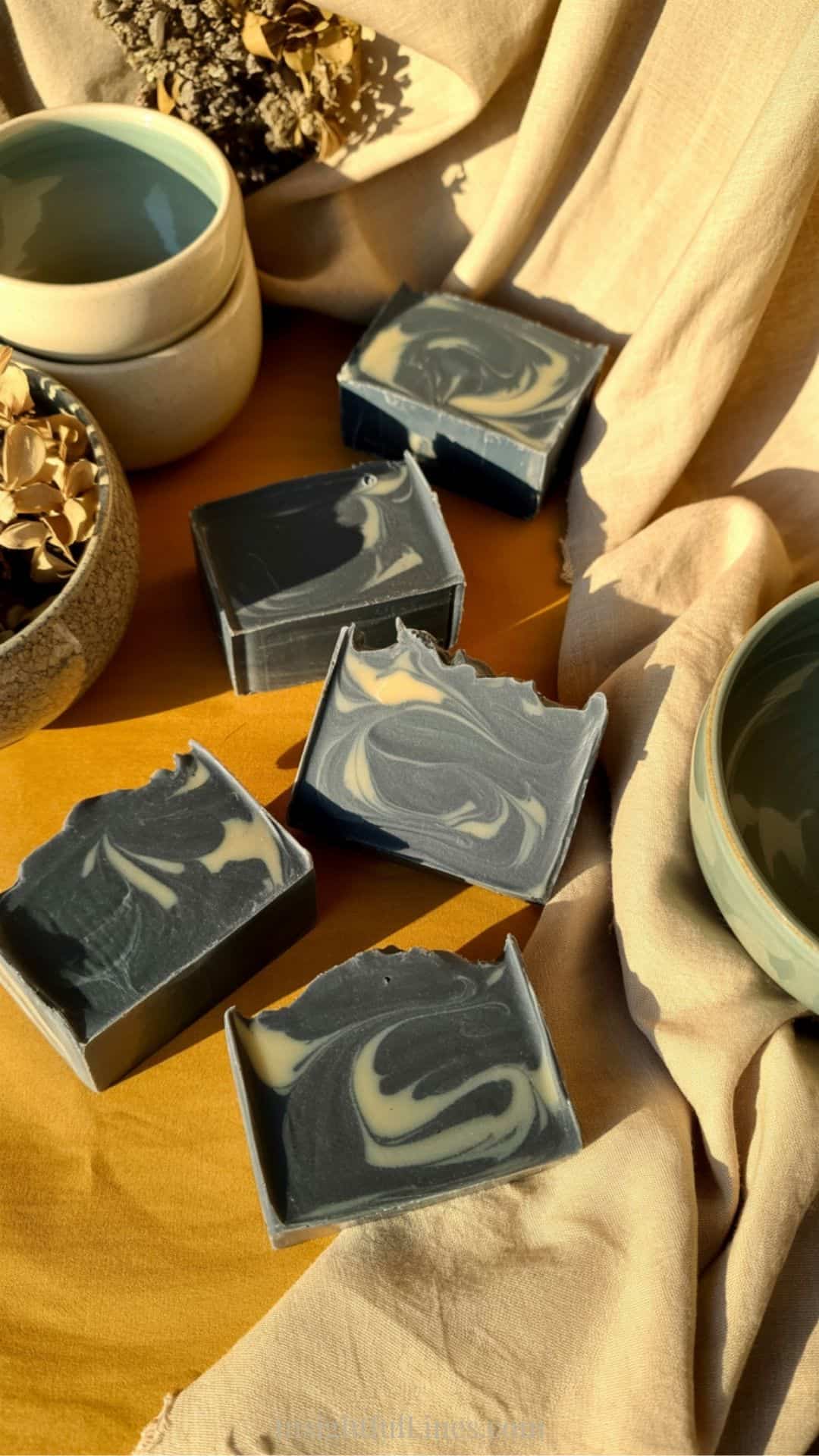 Charcoal melt and pour soap bars with slightly textured edges and a rustic artisan finish